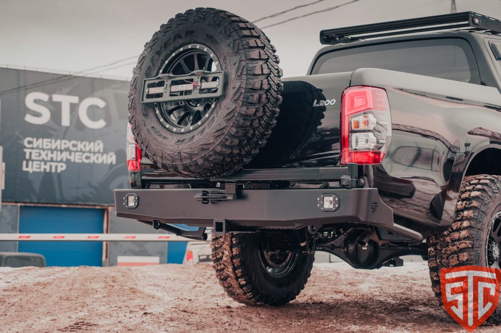 Бампер задний Mitsubishi L200 2019+ калитка центр, под ПТФ Бампер задний Mitsubishi L200 2019+ калитка центр, под ПТФ